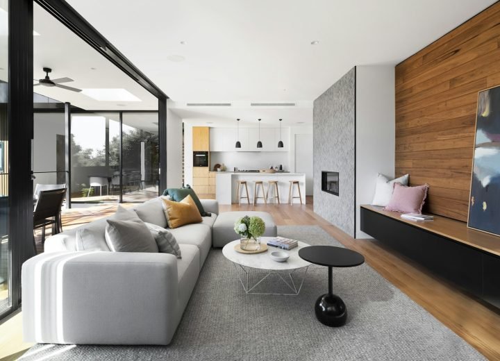 Open-plan living room with sofa and kitchen