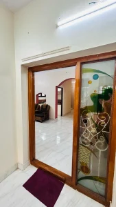 Ramalinganagar Home – Glass doors to the living room
