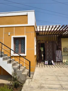 Front of Meena’s Guest Home in Pathukannu, Puducherry, with steps and the entrance