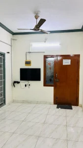 Ramalinganagar Home First Floor – Living room with TV